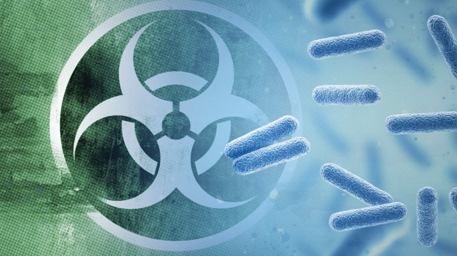 Enlarged images of microbes tinted blue are shown over a toxic waste symbol on a green and blue background