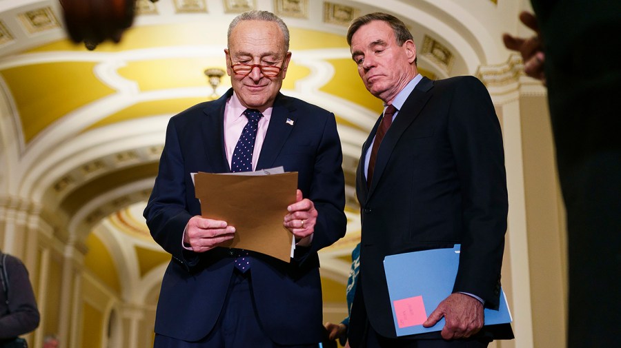 Majority Leader Chuck Schumer (D-N.Y.) and Sen. Mark Warner (D-Va.)