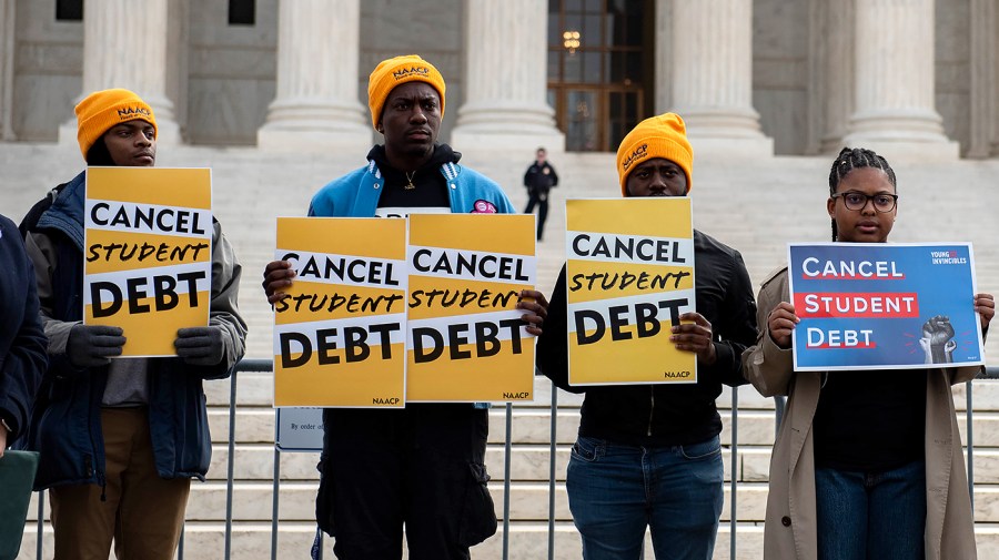 People in favor of President Biden’s student loan forgiveness plan rally in front of the Supreme Court