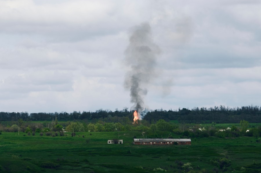 Fire and smoke raise after artillery shelling near Bakhmut, an eastern city where fierce battles between Ukrainian and Russian forces have been taking place, in the Donetsk region, Ukraine, Saturday, April 29, 2023. (AP Photo/Libkos)