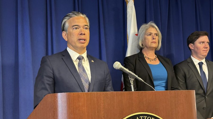 California Attorney General Rob Bonta, left, speaks during a news conference in Sacramento, Calif., on Monday, May 1, 2023. Bonta announced a lawsuit against the city of Elk Grove for not approving an apartment complex for people experiencing homelessness. (AP Photo/Adam Beam)