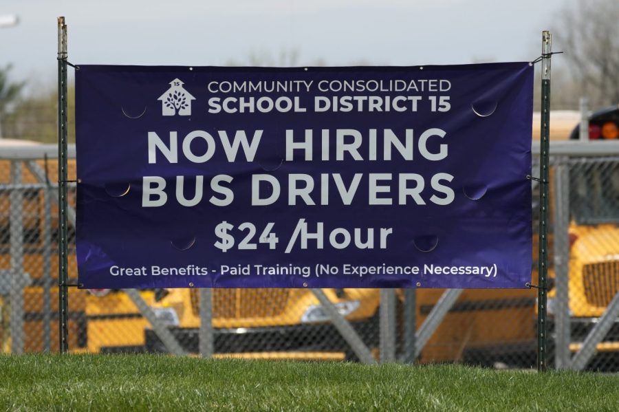 A hiring sign seeking bus drivers is posted in Palatine, Ill., Wednesday, April 19, 2023. On Tuesday, the Labor Department reports on job openings and labor turnover for March.(AP Photo/Nam Y. Huh)