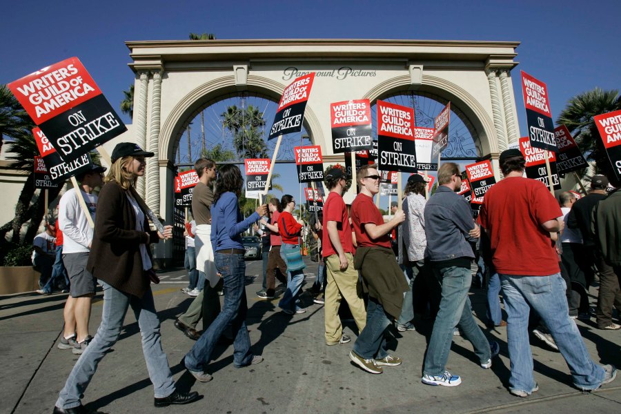 FILE - Striking writers walk the picket line outside Paramount Studios in Los Angeles on Dec. 13, 2007. Television and movie writers on Monday, May 1, 2023, declared that they will launch an industrywide strike for the first time since 2007, as Hollywood girded for a shutdown in a dispute over fair pay in the streaming era. (AP Photo/Nick Ut, File)