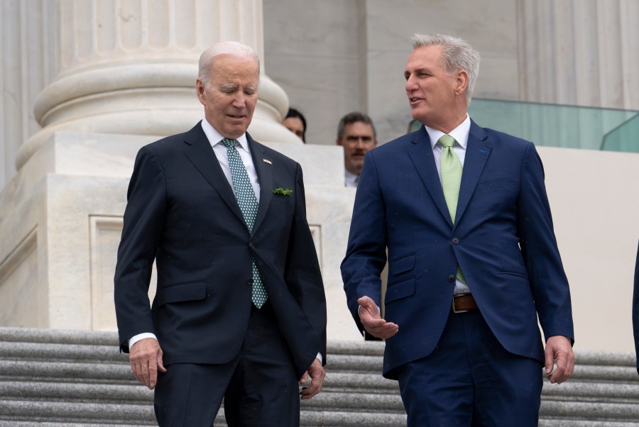 FILE - President Joe Biden walks with House Speaker Kevin McCarthy, R-Calif., as he departs the Capitol following the annual St. Patrick's Day gathering, in Washington, Friday, March 17, 2023. Facing the risk of a government default as soon as June 1, President Joe Biden has invited the top four congressional leaders to a White House meeting for talks. (AP Photo/J. Scott Applewhite, File)