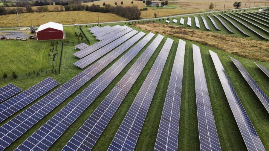 FILE - Farmland is seen with solar panels on Oct. 28, 2021, in Thurmont, Md. (AP Photo/Julio Cortez, File)