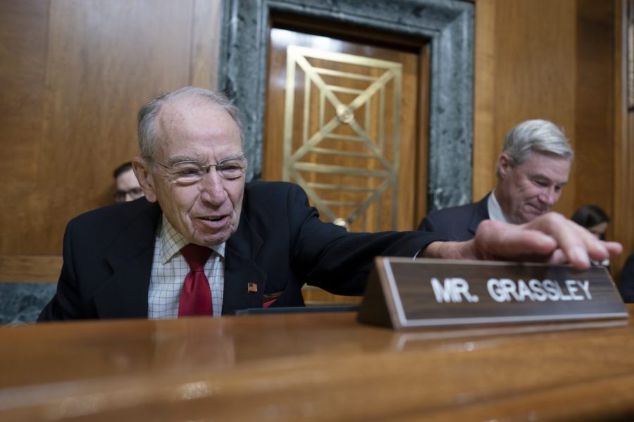 Senate Budget Committee Ranking Member Sen. Chuck Grassley, R-Iowa, left, joins Chairman Sen. Sheldon Whitehouse, D-R.I., at a hearing on the Republican proposal to address the debt limit which passed along party lines in the House last week, at the Capitol in Washington, Thursday, May 4, 2023. Senate Democrats are looking to pressure Republicans into resolving the impasse on the debt ceiling. (AP Photo/J. Scott Applewhite)