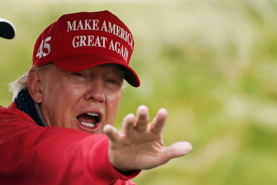 Former US president Donald Trump gestures as he plays golf at Trump International Golf Links & Hotel in Doonbeg, Ireland, Thursday, May 4, 2023, during his visit to Ireland. (Brian Lawless/PA via AP)