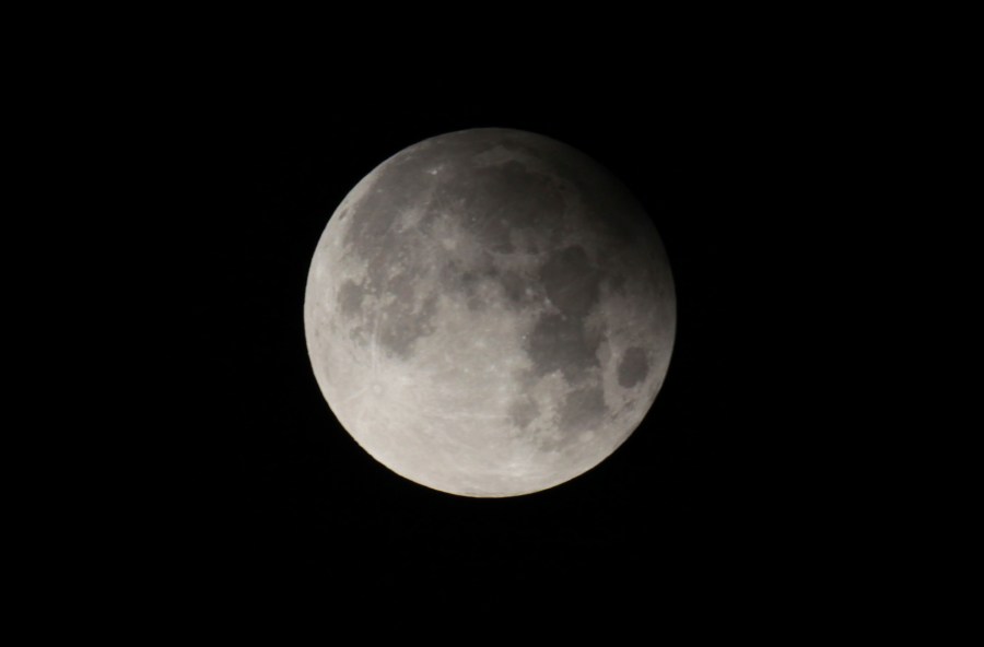 FILE - A penumbral lunar eclipse is seen from Lahore, Pakistan, on Feb. 11, 2017. Late Friday, May 5, 2023, into Saturday, May 6, stargazers in Asia and Australia were treated to a penumbral lunar eclipse, where the moon got only a bit darker and did not exhibit the hallmarks of a total lunar eclipse. (AP Photo/K.M. Chaudhry, File)