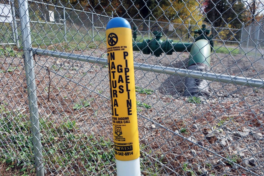 FILE - A MarkWest Liberty natural gas pipeline and fracking well cap is seen in Valencia, Pa., Oct. 14, 2020. The federal agency that regulates pipelines on Friday, May 5, 2023, announced new rules aimed at reducing leaks of methane, a potent greenhouse gas, from a network of nearly 3 million miles of natural gas pipelines that crisscross the country. (AP Photo/Ted Shaffrey, File)