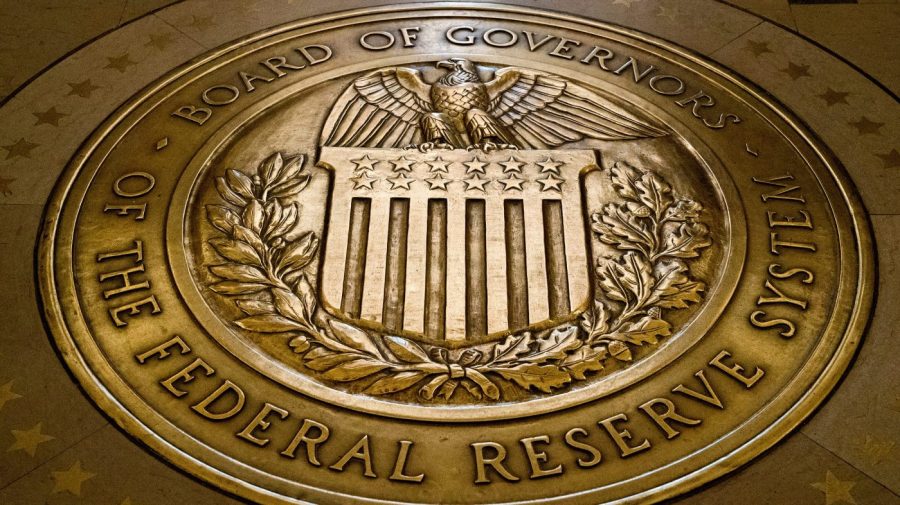 FILE - The seal of the Board of Governors of the United States Federal Reserve System is displayed in the ground at the Marriner S. Eccles Federal Reserve Board Building in Washington, Feb. 5, 2018. A Federal Reserve report Monday, May 8, 2023, showed that banks raised their lending standards for business and consumer loans in the aftermath of three large bank failures, a trend that could slow the economy in coming months. (AP Photo/Andrew Harnik, File)