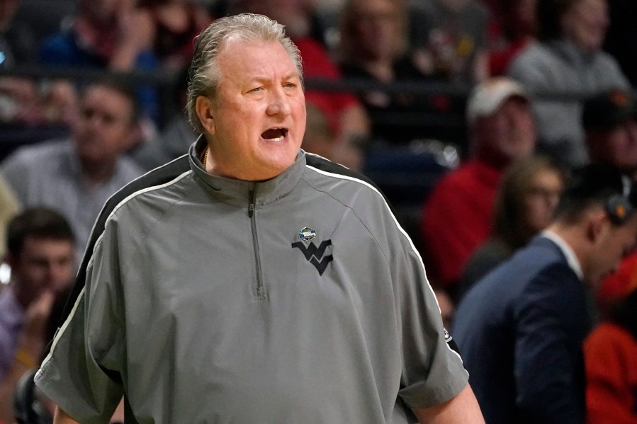 FILE - West Virginia head coach Bob Huggins calls to his players in the second half of a first-round college basketball game against Maryland in the NCAA Tournament in Birmingham, Ala., March 16, 2023. Huggins apologized Monday, May 8, 2023, after using a homophobic slur to refer to Xavier fans during a radio interview. (AP Photo/Rogelio V. Solis, File)