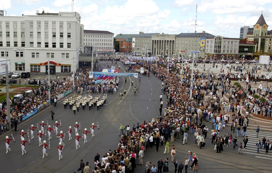 FILE - People gather to watch a festive parade marking the 750th anniversary of Kaliningrad, Russia's westernmost city, Friday, July 1, 2005. Poland's map authorities have advised the return to the historic name of Russia's neighbouring city and the administrative region of Kaliningrad, which is Krolewiec. The decision by a commission for geographic names abroad advising the reversal took effect this week, Tuesday, May 9, 2023. (AP Photo/Sergey Ponomarev, File)