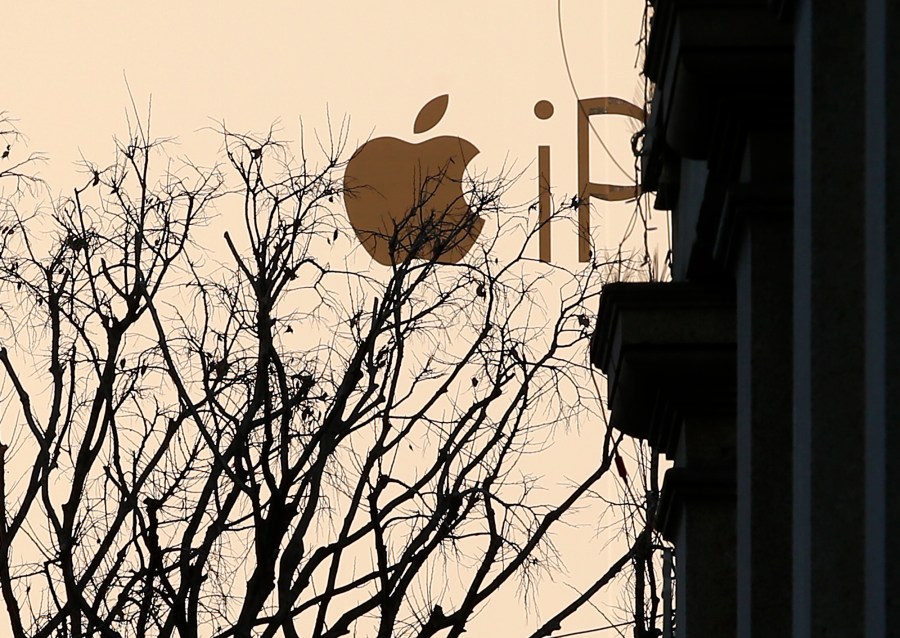 FILE - A huge publicity billboard is seen in downtown Milan, Italy, on Dec. 30, 2015. Italy’s anti-trust authority has opened an investigation into allegations that Apple is abusing its dominant position in the app market, officials said Thursday, May 11, 2023. (AP Photo/Antonio Calanni)