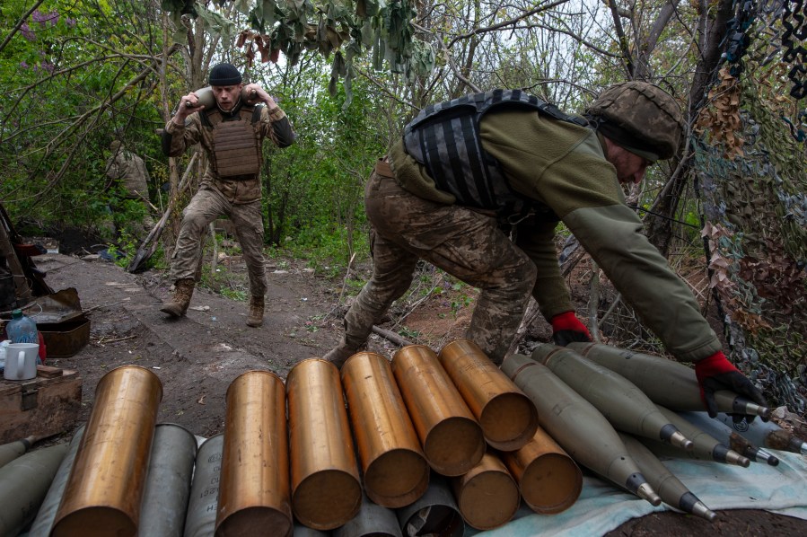 Ukrainian soldiers prepare self-propelled howitzer shells in Chasiv Yar, the site of heavy battles with the Russian forces in the Donetsk region, Ukraine, Thursday, May 11, 2023. (Iryna Rybakova via AP)