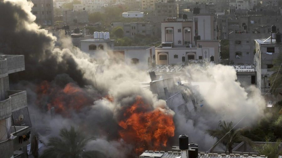 Smoke and fire rise from an explosion caused by an Israeli airstrike targeting a building in Gaza, Saturday, May 13, 2023. The building was owned by an Islamic Jihad official. (AP Photo/Ashraf Amra)