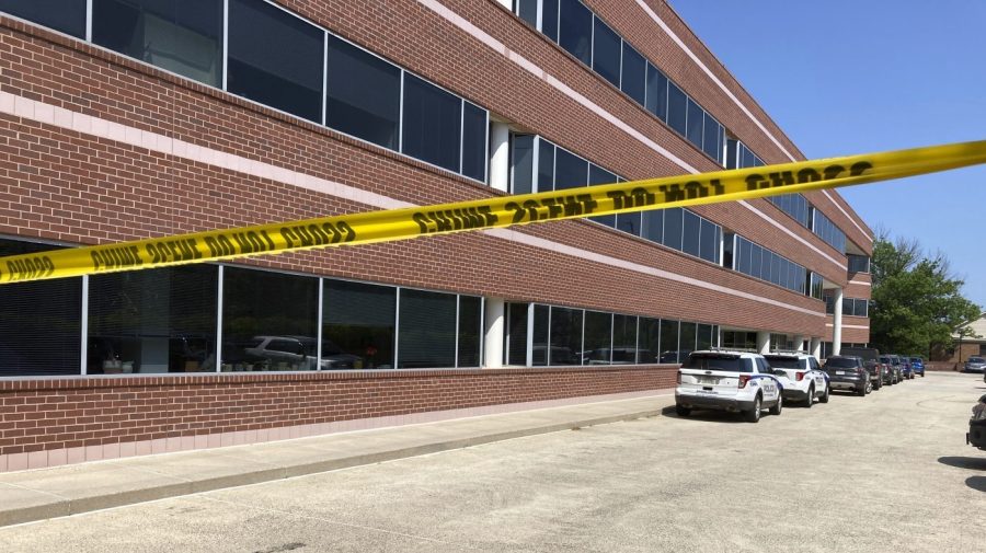 Crime scene tape blocks the Fairfax, Va., office building where police say a man wielding a baseball bat attacked two staffers for U.S. Rep. Gerry Connolly, D-Va., on Monday morning, May 15, 2023. (AP Photo/Matthew Barakat)