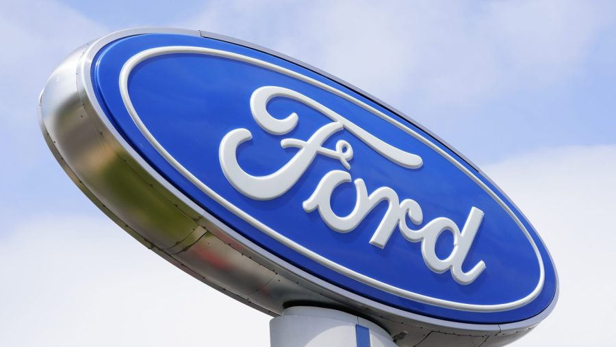 FILE - A Ford sign is shown at a dealership in Springfield, Pa., Tuesday, April 26, 2022. (AP Photo/Matt Rourke, File)