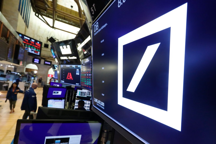 FILE - The logo for Deutsche Bank appears above a trading post on the floor of the New York Stock Exchange, Monday, July 8, 2019. Deutsche Bank has agreed to pay $75 million to settle a lawsuit, Thursday, May 18, 2023, claiming that the German lender should have seen evidence of sex trafficking by Jeffrey Epstein when he was a client, according to lawyers for women who say they were abused by the late financier.(AP Photo/Richard Drew, File)