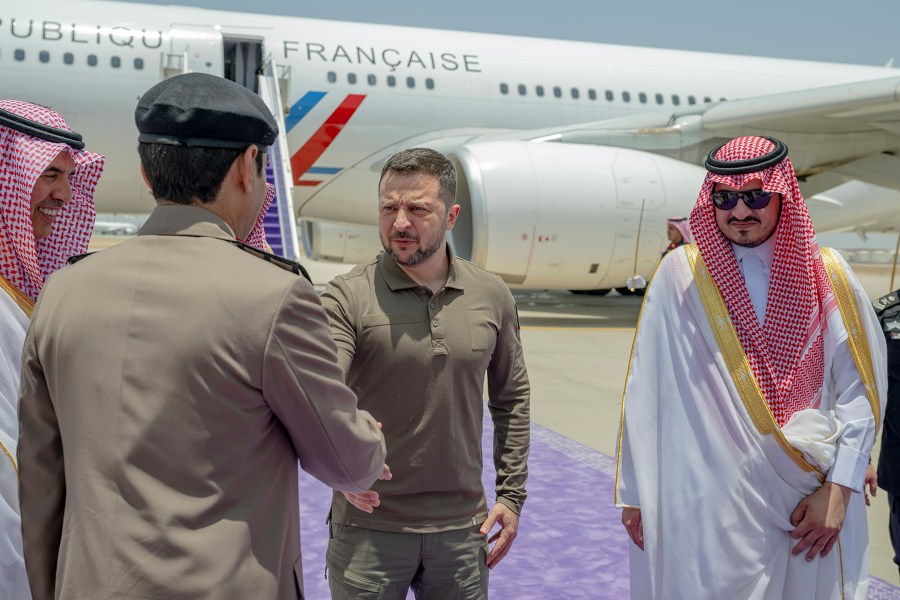 In this photo provided by Saudi Press Agency, SPA, Ukraine's President Volodymyr Zelenskyy is greeted by Prince Badr Bin Sultan, deputy governor of Mecca, right, upon his arrival at Jeddah airport, Saudi Arabia, Friday, May 19, 2023. Zelenskyy arrived in Saudi Arabia ahead of an Arab summit on Friday, where he was set to address leaders who have remained largely neutral on Russia's invasion of his country, including many who maintain warm ties with Moscow. (Saudi Press Agency via AP)