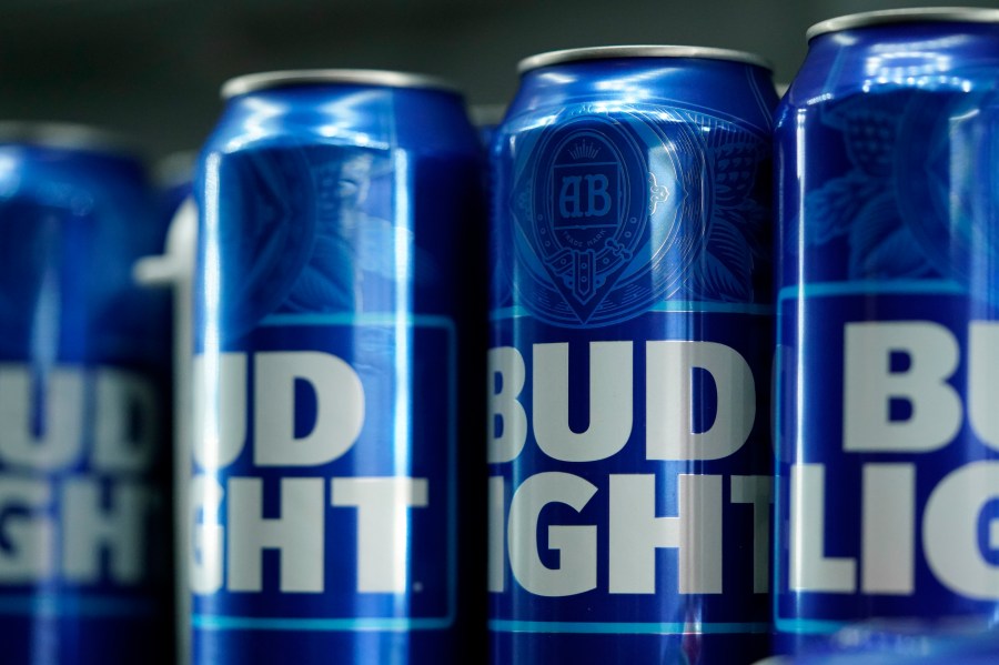 FILE - Cans of Bud Light beer are seen before a baseball game between the Philadelphia Phillies and the Seattle Mariners on April 25, 2023, in Philadelphia. The country's largest advocacy group for LGBTQ+ rights has suspended its benchmark equality and inclusion rating for Anheuser-Busch, citing the beer company's handling of hate-filled and transphobic backlash received after its partnership with transgender influencer Dylan Mulvaney in April. (AP Photo/Matt Slocum, File)