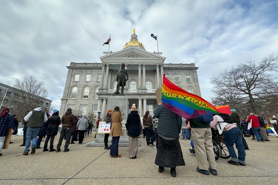 FILE - Advocates for transgender youth rally outside the New Hampshire Statehouse, in Concord, N.H., Tuesday, March 7, 2023.