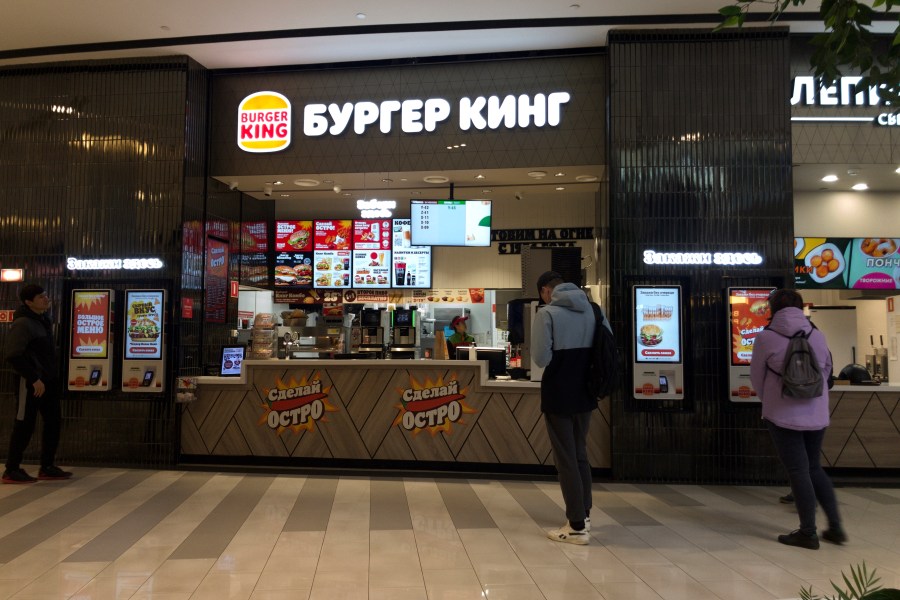 A Burger King kiosk is seen at Paveletskaya Plaza shopping mall in Moscow, Russia, Wednesday, May 3, 2023. When Russia invaded Ukraine, companies were quick to respond, some announcing they would get out of Russia immediately, others vowed to curtail sales and new investment. More than a year later, it’s clear: Leaving Russia isn't as easy as the first announcements might have made it seem. (AP Photo/Alexander Zemlianichenko)