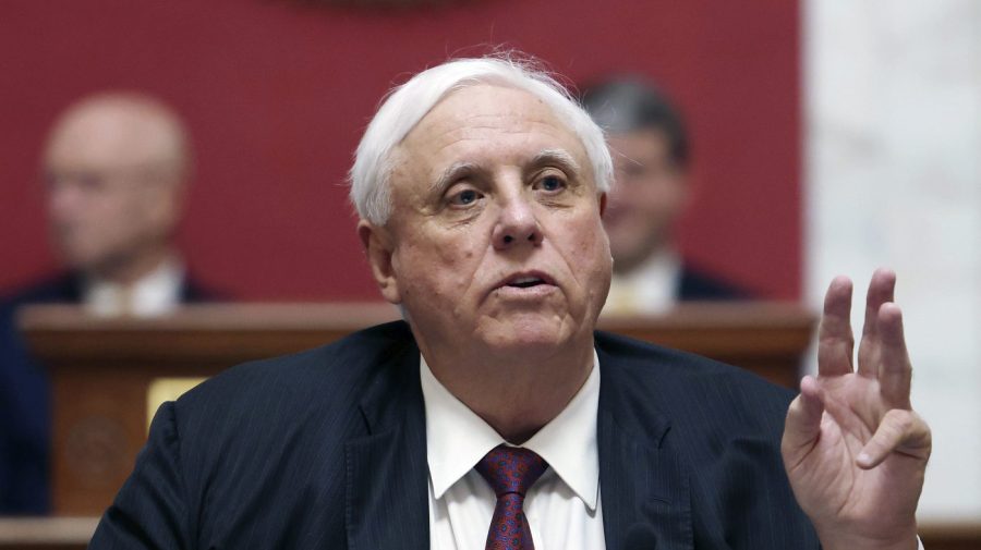 FILE - West Virginia Gov. Jim Justice delivers his annual State of the State address in the House Chambers at the West Virginia Capitol, Jan. 11, 2023, in Charleston, W.Va. The federal government filed a lawsuit on Tuesday, May 30, against coal mines owned by the family of Justice seeking payment of unpaid penalties for previous mining law violations. (AP Photo/Chris Jackson, File)