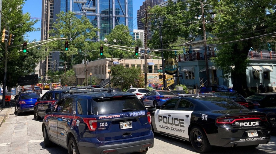 Emergency vehicles arrive on West Peachtree in Atlanta on Wednesday, May 3, 2023. Police say are investigating an “active shooter situation” in a building in Atlanta's Midtown neighborhood and that multiple people had been injured.