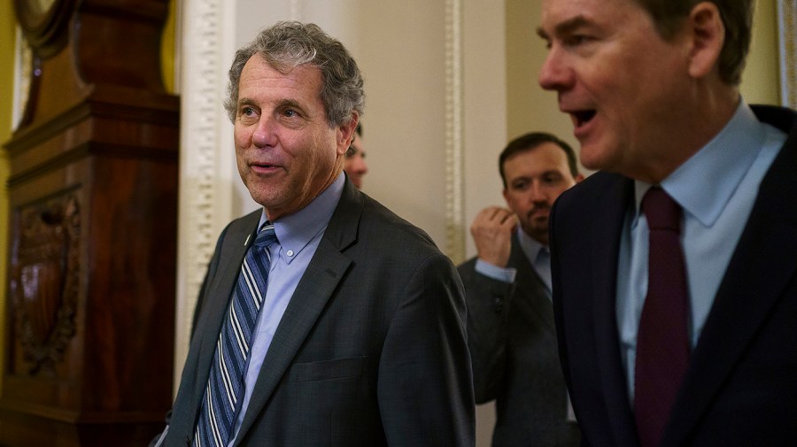 Sen. Sherrod Brown (D-Ohio) and Michael Bennet (D-Colo.)