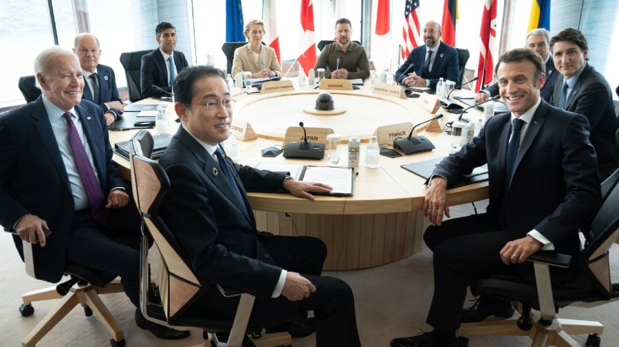 Ukrainian President Volodymyr Zelenskyy, center rear, joins G7 world leaders at a working session on the final day of the G7 Summit in Hiroshima, Japan, Sunday, May 21, 2023. From left to right are: Japan's Prime Minister Fumio Kishida, U.S. President Joe Biden, German Chancellor Olaf Scholz, Britain's Prime Minister Rishi Sunak, European Commission President Ursula von der Leyen, Zelenskyy, European Council President Charles Michel, Gianluigi Benedetti, Italian ambassador to Japan, Canada's Prime Minister Justin Trudeau, and France's President Emmanuel Macron.