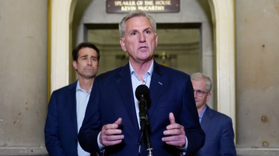 House Speaker Kevin McCarthy of Calif., speaks during a news conference after President Joe Biden and McCarthy reached an "agreement in principle" to resolve the looming debt crisis on Saturday, May 27, 2023, on Capitol Hill in Washington. Rep. Patrick McHenry, R-N.C., a key Republican in the debt limit negotiations and chairman of the House Financial Services Committee, back right, and Rep. Garret Graves, R-La., McCarthy's top mediator in the debt limit talks, left, look on.