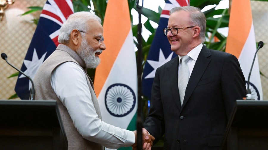 India's Prime Minister Narendra Modi, left, shakes hands with Australian Prime Minister Anthony Albanese following a joint press conference at Admiralty House in Sydney, Australia, Wednesday, May 24, 2023. Modi is the only leader of the so-called Quad nations to continue with his scheduled visit to Australia after U.S. President Joe Biden pulled out of a planned meeting of the group in Sydney to return to Washington to focus on debt limit talks. (Dean Lewins/Pool Photo via AP)