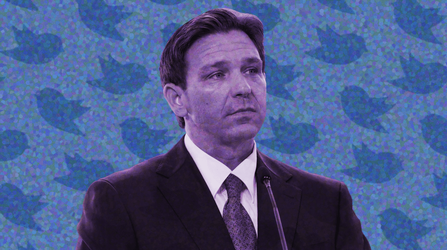 Photo illustration of Ron DeSantis, purple-toned, over a heavily pointillized light blue background with a diagonal pattern of darker blue twitter birds overlaying the background.