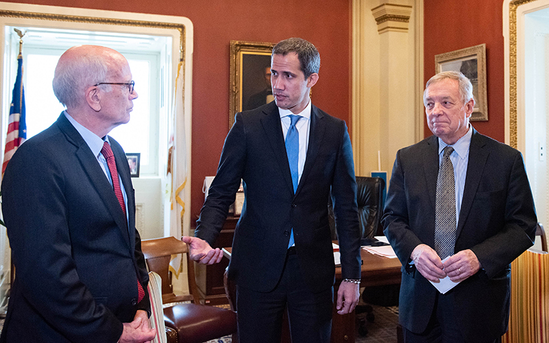 Sens. Richard Durbin (D-Ill.) and Peter Welch (D-Vt.) greet former Venezuelan President Juan Guaidó