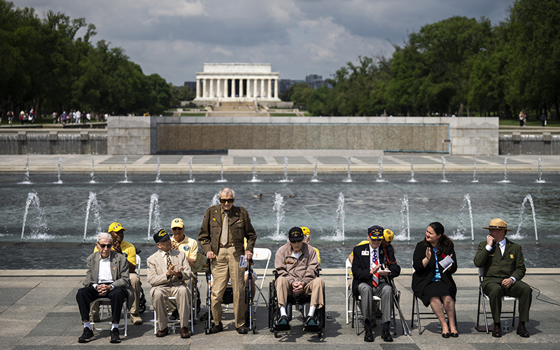 World War II veteran Valentine DaDamio stands to be recognized during a wreath-laying ceremony