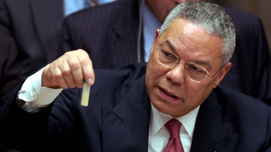 FILE - This photo by Associated Press photographer Elise Amendola shows US Secretary of State Colin Powell holding a vial of what he said could have been a biological weapon during a meeting on the invasion of Iraq in the United Nations Security Council on Wednesday, Feb. 5, 2003. (AP Photo/Elise Amendola, File)