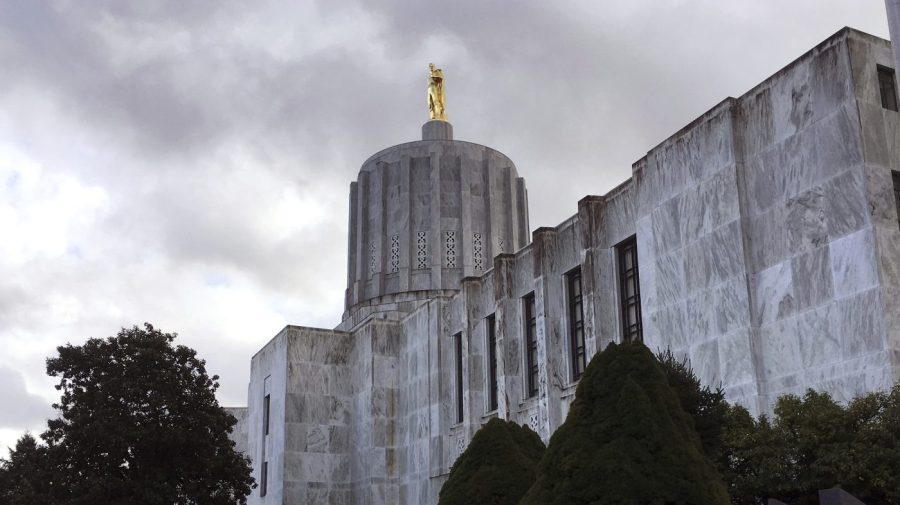 FILE - Clouds hover over the Oregon Capitol, Jan. 11, 2018, in Salem, Ore. Oregon Senate