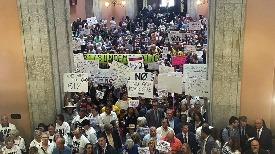 FILE - Supporters and opponents of a GOP-backed measure that would make it harder to amend the Ohio constitution packed the statehouse rotunda Wednesday, May 10, 2023, in Columbus, Ohio. In a blow to abortion opponents in Ohio, a fall ballot issue aimed at enshrining access to the procedure in state's constitution will not be split into two separate issues — one about abortion, and one about all other reproductive care.(AP Photo/Samantha Hendrickson, File)