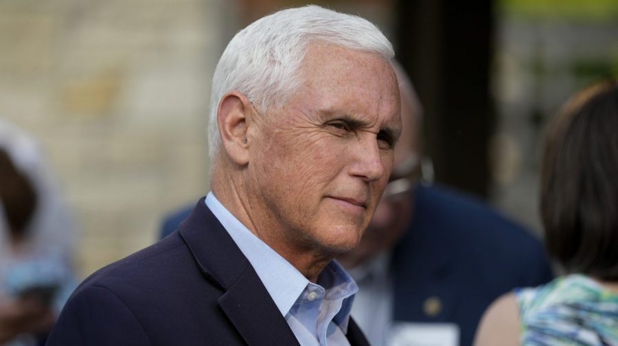 FILE - Former Vice President Mike Pence talks with local residents during a meet and greet on May 23, 2023, in Des Moines, Iowa. Pence will officially launch his widely expected campaign for the Republican nomination for president in Iowa on June 7. (AP Photo/Charlie Neibergall)