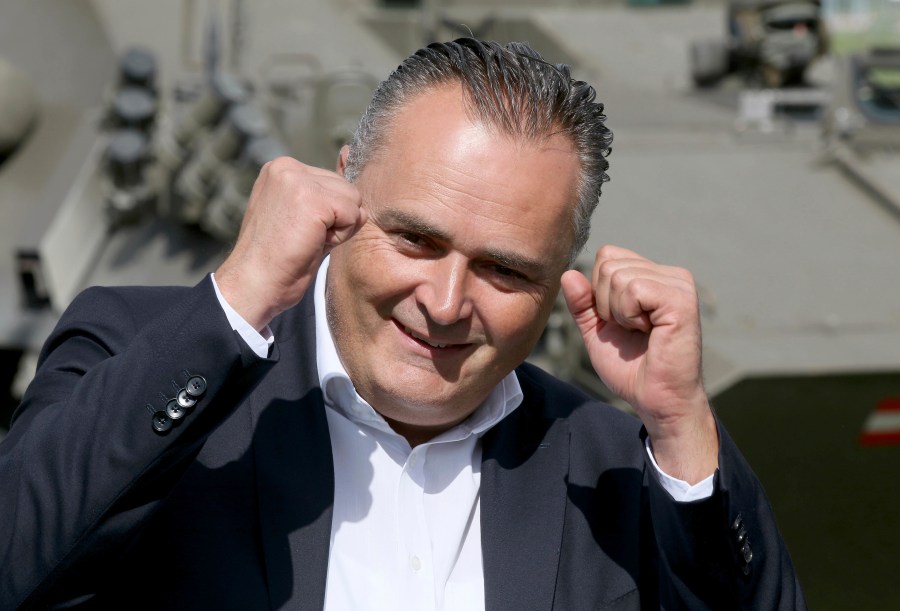 FILE - Then Austrian defense minister Hans Peter Doskozil reacts during a joint military exercise in Allensteig, Austria, Friday, Sept. 15, 2017. Austria’s main center-left opposition party has reversed the result of its weekend leadership election, announcing that a computer error originally led to the wrong candidate being declared the winner. At a hastily called news conference on Monday, the head of the party's electoral commission announced that it was in fact Andreas Babler and not Hans Peter Doskozil who won, taking 317 votes to Doskozil's 280, the Austria Press Agency reported. (AP Photo/Ronald Zak, File)