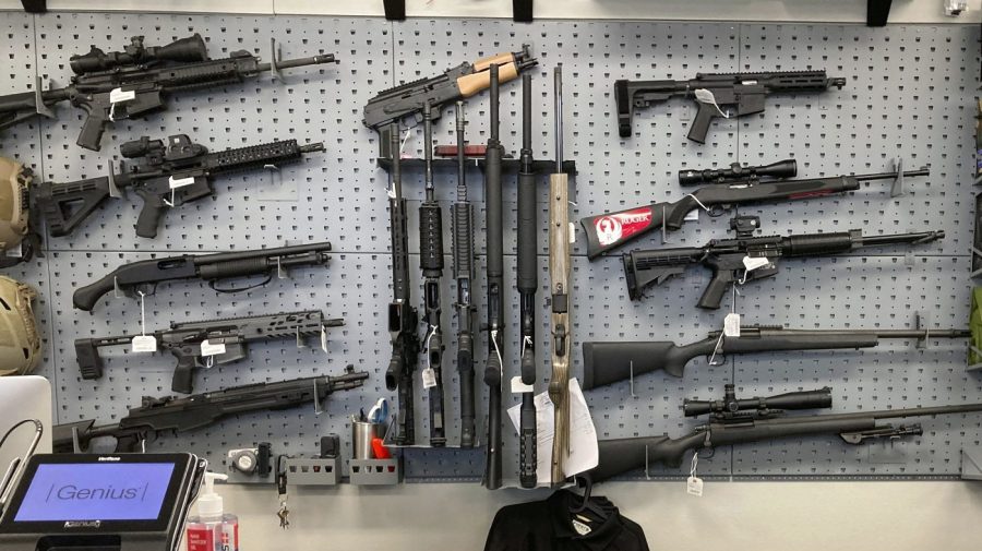 FILE - Firearms are displayed at a gun shop in Salem, Ore., Feb. 19, 2021. A federal judge in Portland, Ore., will hear arguments Monday, June 5, 2023, over the constitutionality of one of the nation's strictest gun control laws that was approved by voters last year. The law, which includes a permit-to-purchase provision for gun owners, has been challenged in both federal court and state court and the legal battle over Measure 114 is likely to continue no matter the outcome this week. (AP Photo/Andrew Selsky, File)