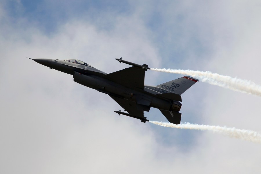 A Lockheed Martin F-16 Jet fighter performs its demonstration flight, June 22, 2011. (AP Photo/Francois Mori)