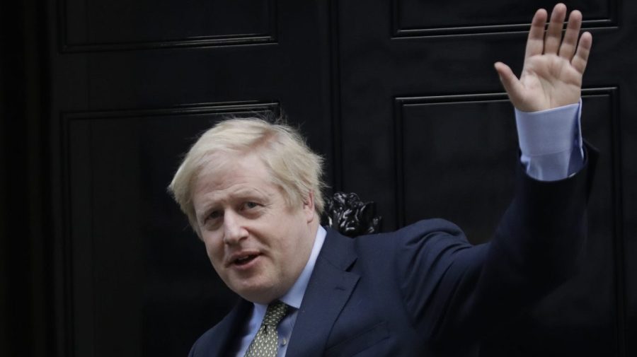 Then-Britain's Prime Minister Boris Johnson returns to 10 Downing Street after meeting with Queen Elizabeth II at Buckingham Palace, London, on Friday, Dec. 13, 2019.