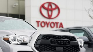 A logo of Toyota Motor Corp. is seen at its dealership in Lakewood, Colo., on March 21, 2021. Toyota says it plans to make an all solid-state battery as part of ambitious plans for battery electric vehicles, amid mounting criticism Japan’s top automaker needs to do more to fight climate change. (AP Photo/David Zalubowski)