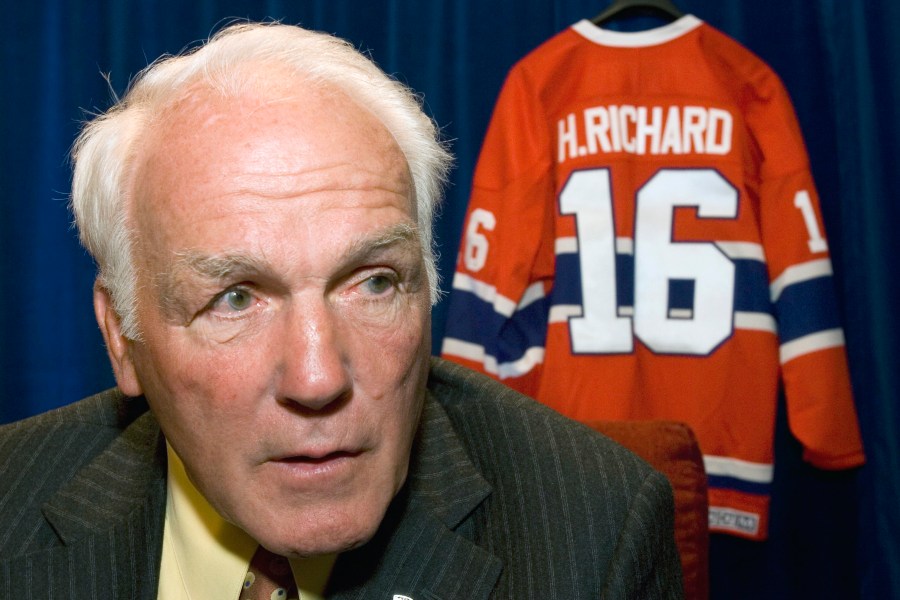 FILE - Montreal Canadiens' Henri Richard responds to questions in Ottawa, June 1, 2007. Richard’s family says the Hockey Hall of Famer has been diagnosed with chronic traumatic encephalopathy, the degenerative brain disease linked to concussions. Richard, who died in 2020 at the age of 84, was diagnosed with Stage 3 CTE – the second-most severe classification -- by Dr. Stephen Saikali at Université Laval in Québec City. (Paul Chiasson, Canadian Press via AP)