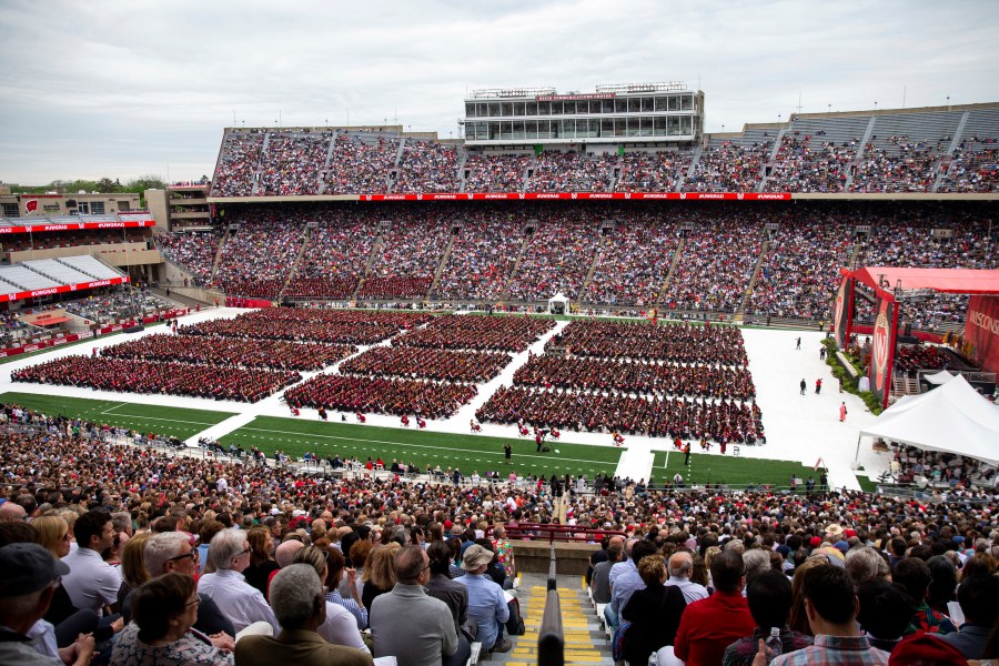 FILE - Attendees watch the 170th University of Wisconsin-Madison commencement ceremony at Camp Randall Stadium in Madison, Wis., on May 13, 2023. Republican lawmakers were poised Tuesday, June 13, to cut funding for University of Wisconsin campuses as the GOP-controlled state Legislature and school officials continue to clash over efforts to promote diversity and inclusion. (Samantha Madar/Wisconsin State Journal via AP, File)