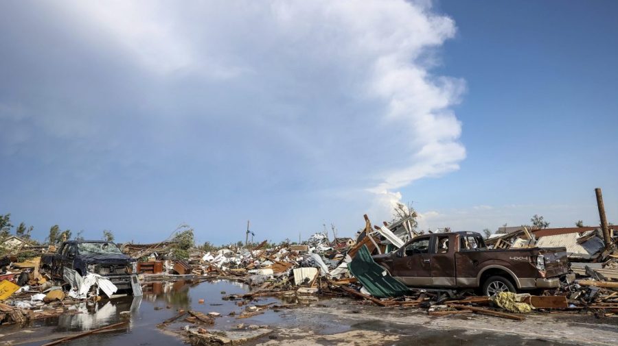 Damaged pickup trucks sit among debris after a tornado passed through a residential area in Perryton, Texas, Thursday, June 15, 2023. (AP Photo/David Erickson)