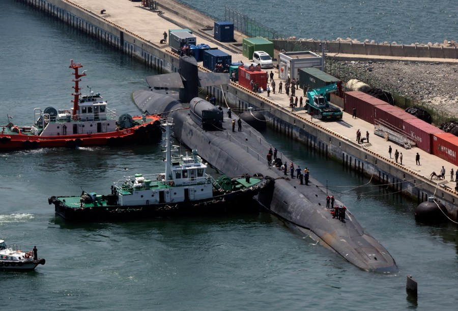 The nuclear-powered submarine USS Michigan approaches a naval base in Busan, South Korea, Friday, June 16, 2023. The United States deployed the nuclear-powered submarine capable of carrying about 150 Tomahawk missiles to South Korea on Friday, a day after North Korea resumed missile tests in protest of the U.S.-South Korean live-fire drills. (Gang Duck-chul/Yonhap via AP)