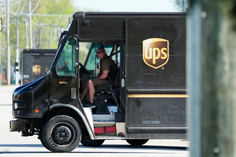 A UPS truck makes deliveries in Northbrook, Ill., Wednesday, May 10, 2023. Unionized UPS workers voted overwhelmingly on Friday, June 16, to authorize a strike, setting the stage for a potential work stoppage if the package delivery company and Teamsters can’t come to an agreement before their contract expires next month.(AP Photo/Nam Y. Huh)