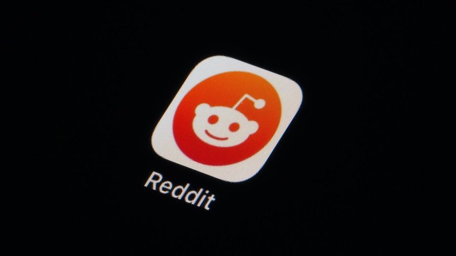 The Reddit app icon is seen on a smartphone, Tuesday, Feb. 28, 2023, in Marple Township, Pa. Reddit is facing an ongoing blackout from some of its most active users. After outrage erupted over plans to charge some third party apps for API, thousands of communities within the online discussion network went dark this week — and many organizers say their protest is not over. (AP Photo/Matt Slocum)